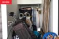 Before: Beige nook full of sports equipment and other random storage