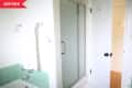 Before: Bathroom with mint green square tile and frosted glass shower