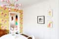 board and batten wall with pictures hanging