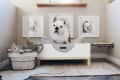 small dog-sized "room" with dog bed, crate for toys, a gallery wall, and more