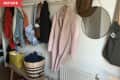 Before: entryway over-filled with coats, hats, bags, and more hanging from a single peg rail