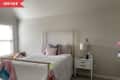 Before: mostly bare white bedroom with bed and nightstand