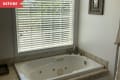 Before: 2010 builder's bathtub beneath window