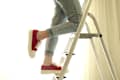 girl climbing a step ladder