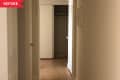 Before: hallway with beige walls and no decor