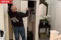 Before: Man removing doors from hall closet