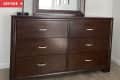 Before: dark brown stained wood dresser