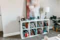 Before: Plain white IKEA KALLAX console with books