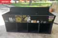 Before: record cabinet painted black and covered with stickers