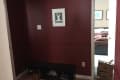 Before: Dark, cramped entryway with deep red walls