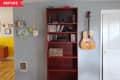 Before: Red painted bookshelf with bottom two shelves empty