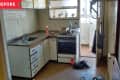 Before: Run-down and dated kitchen