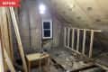 Before: Unfinished attic with slanted roof line