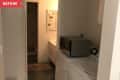 Before: Laundry room with 1999 Hotpoint washer and dryer