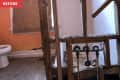 Before: Dilapidated bathroom with orange walls