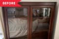 Before: Dark wood glass-front cabinet