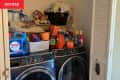 messy laundry room before remodel