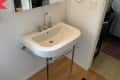 Before: Pedestal sink in bathroom
