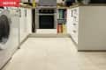 Before: White kitchen with white tile floors