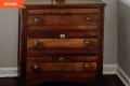 Before: vintage wood dresser with keyholes on the drawer fronts
