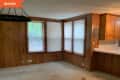 Before photo with wooden walls