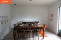 White kitchen with wooden dining table