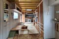 Before: Interior of RV with brown ceiling, floors, and cabinets