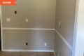 Before: gray wall and empty corner of room