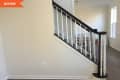 Before: Blank wall by stairs