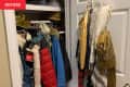 overstuffed, disorganized closet before makeover