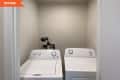 Before: an empty laundry room with only two machines