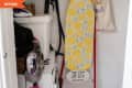 Before: Small cluttered laundry room