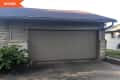 Before: Gray garage door