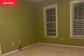 Before: an empty green room with blinds on the windows
