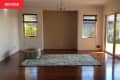 Before: and empty room with a blue rug