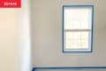 Before: a white room with a room and painters tape along the edges of the walls and windows