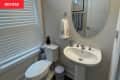 Before: a beige painted bathroom wall