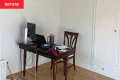 Before: Desk in corner of office with white walls