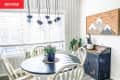 Before: a white dining room with a round table and four white chairs