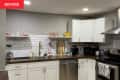 Before: Contemporary kitchen with gray walls