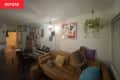Living room with white walls , furniture, musical instruments before a painting project begins.