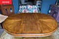 Oval wood dining table before makeover.