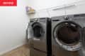 Before: a white laundry room with two silver machines