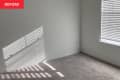 Before: an empty white room with beige carpeting
