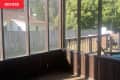 Dark painted screened in porch before renovation