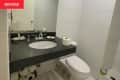 Before: Bathroom with black countertop