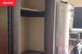 An empty closet by the kitchen