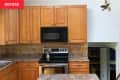 Wooden cabinets in kitchen before renovation.