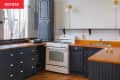 white kitchen with blue cabinets before renovation