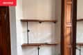 Shelves in home library before renovation.